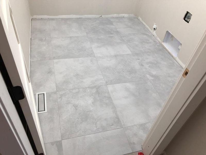 Laundry room tile floor in Blind Bay, BC