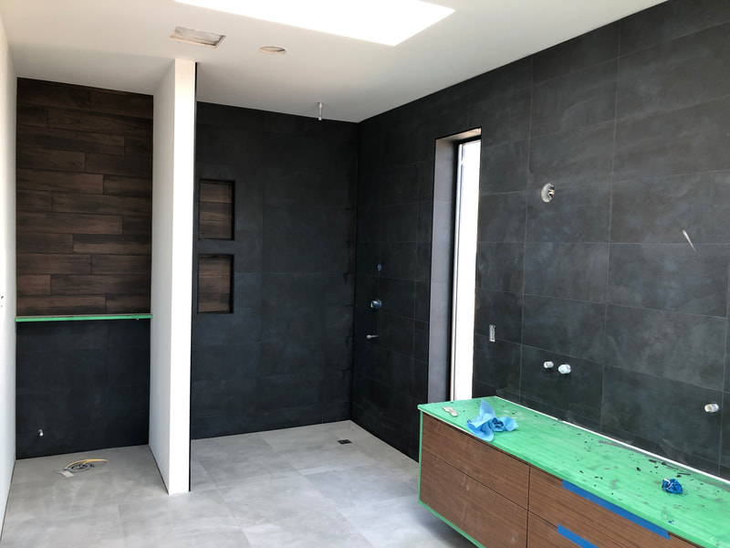 Custom curbless tile shower and feature walls in Blind Bay, BC