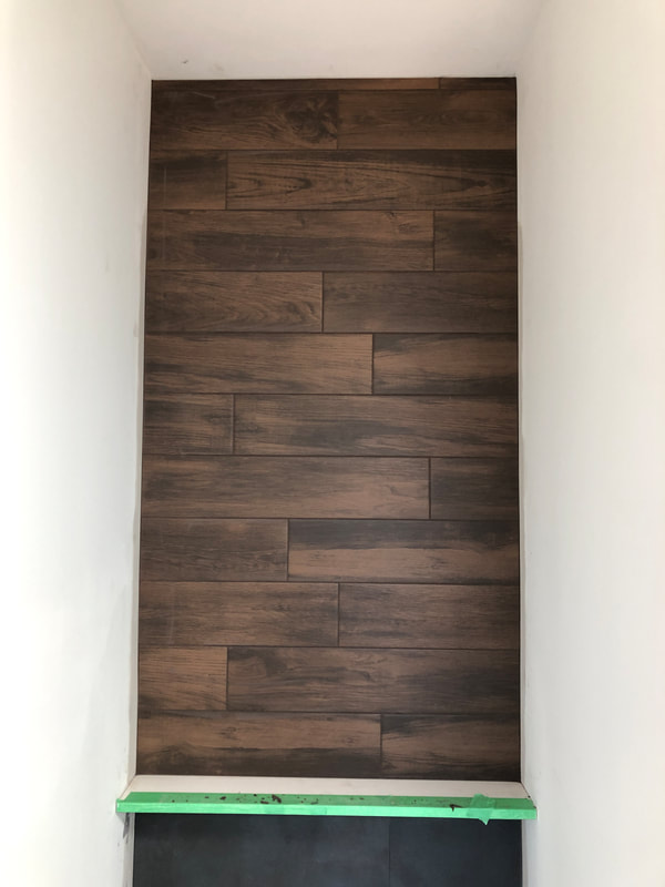 Feature wood Tile Wall behind toilet in Blind Bay, BC