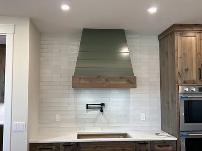 Full-Height White Subway Backsplash Behind Range Hood