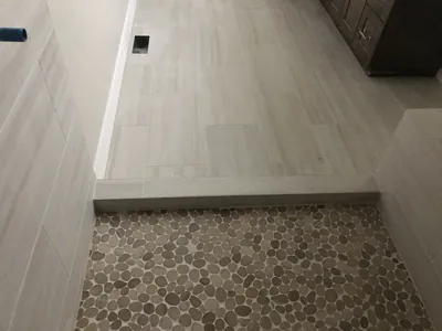 Custom Shower w/ Bench and Pebble Floor Features 5