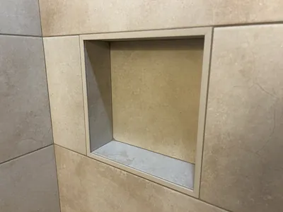 Custom Tile Shower w/ Bench, Pony Wall, Niche, and Feature Band Details 12