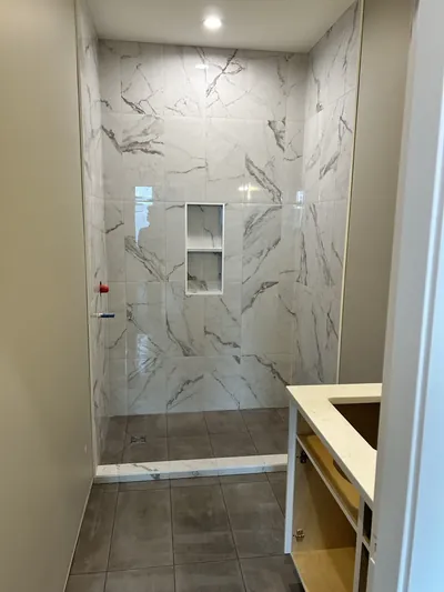 Custom Tile Shower w/ Wall Coloured Tile Curb 2