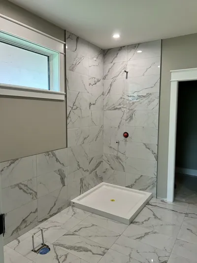 Stacked Layout Glossy Carerra Tile Shower Surround 1