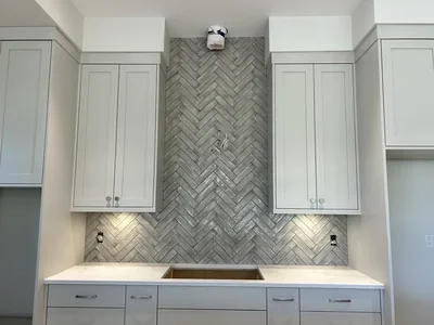 Herringbone tile backsplash Installation